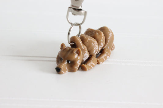3D-printed brown grizzly bear keychain with a silver swivel quick-clip on a white background.