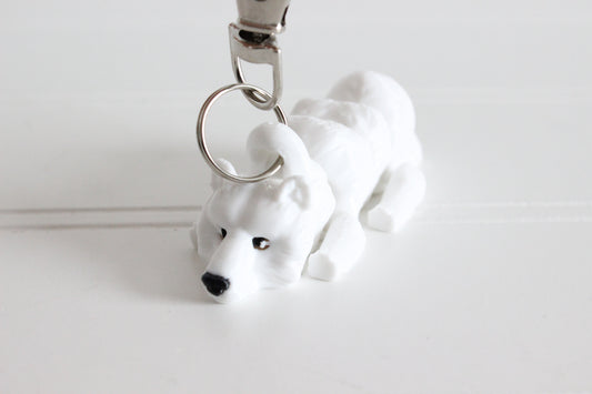 3D-printed white polar bear keychain with a silver swivel quick-clip on a white background.