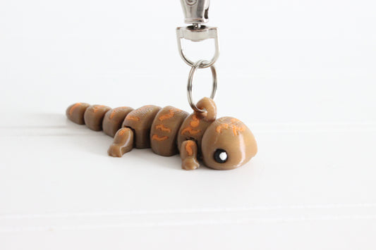 3D-printed mottled brown hellbender salamander keychain with a silver swivel quick-clip on a white background.