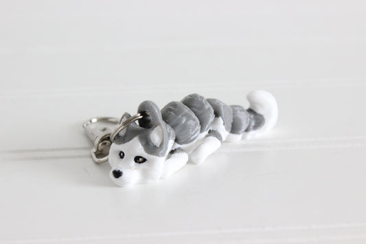 3D-printed gray-and-white husky keychain with a silver swivel quick-clip on a white background.