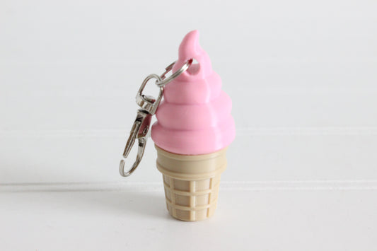 3D-printed strawberry soft-serve ice cream cone keychain with a metal key ring.