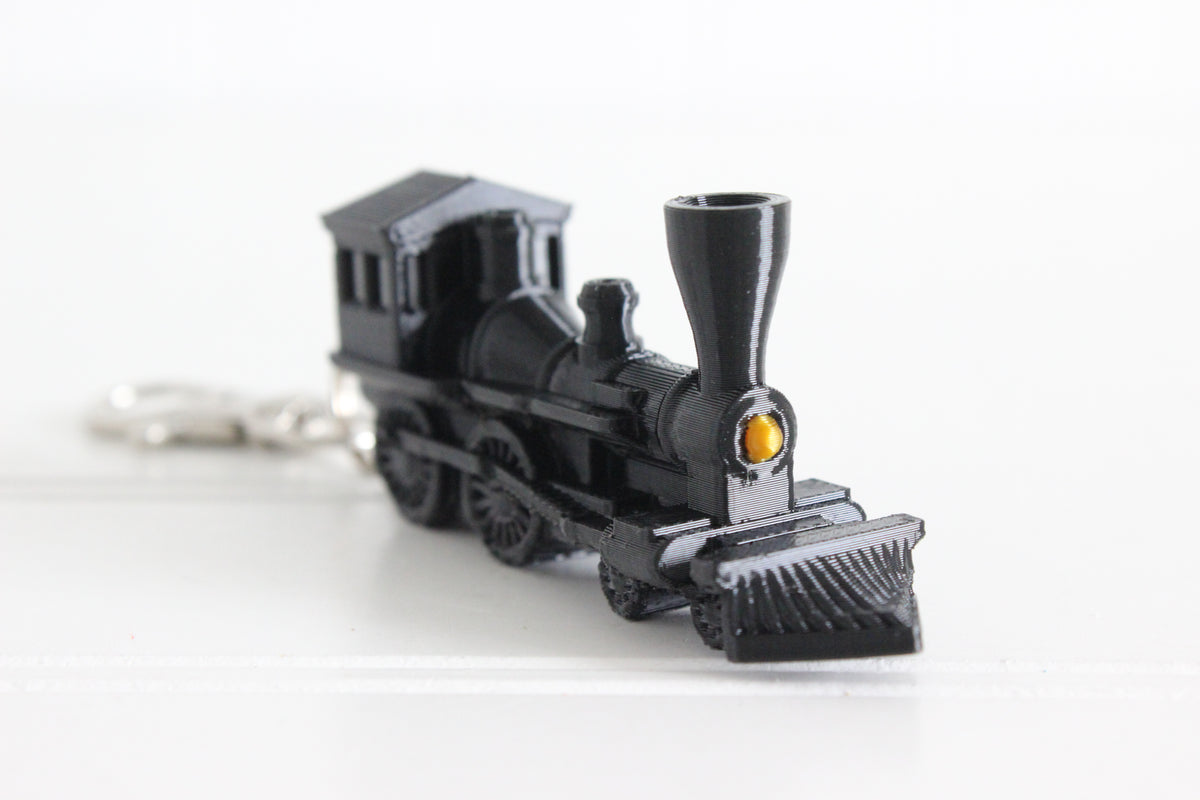3D-printed train keychain with a silver swivel quick-clip on a white background.