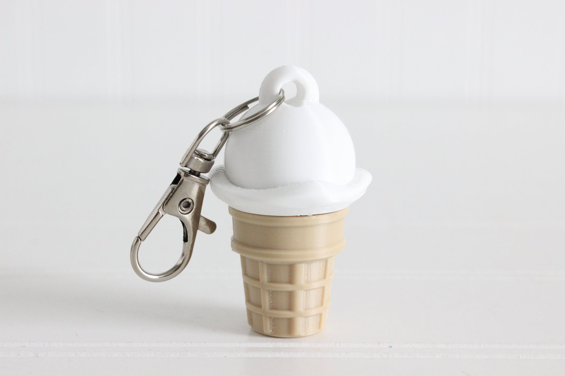 Vanilla ice cream cone 3D printed keychain with metal key ring.