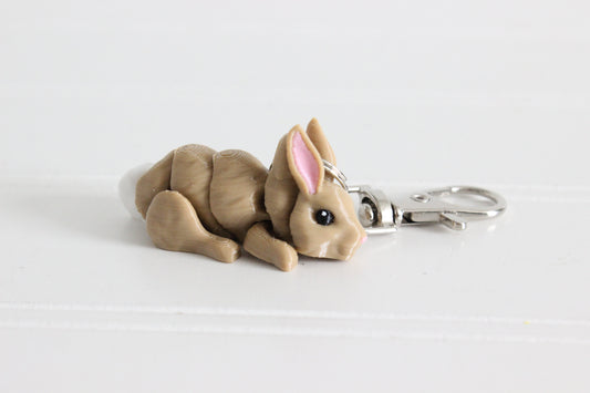 3D-printed brown rabbit keychain with a silver swivel quick-clip on a white background.