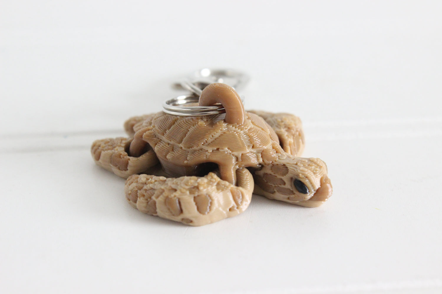 3D printed brown sea turtle keychain with silver key ring