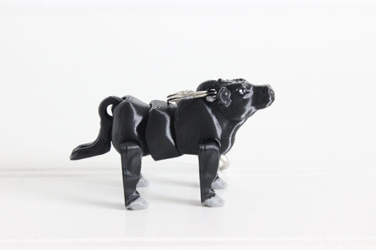 Black Angus cow keychain on a white background